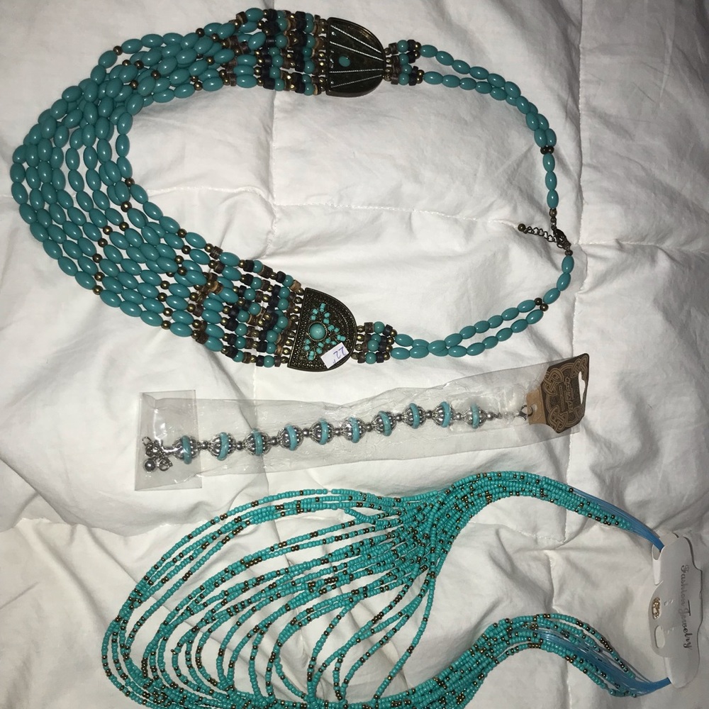 2 teal multi strand necklaces and a teal bracelet
